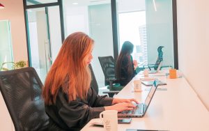 Two women working on a laptop