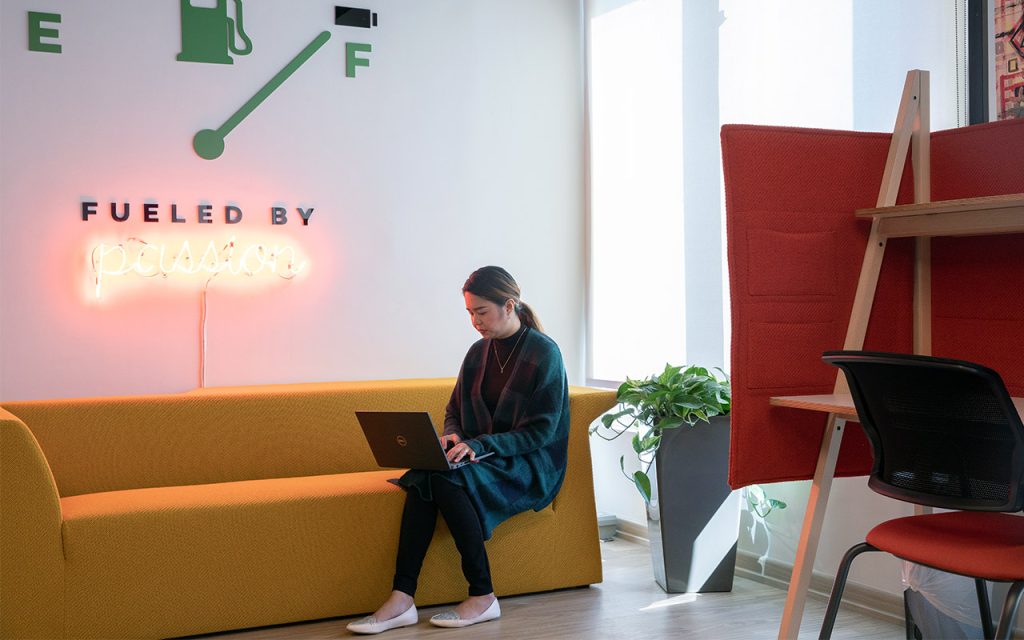 Woman working in a sofa